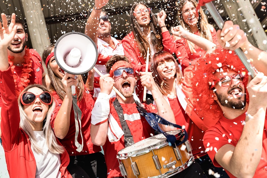 People in red celebrating