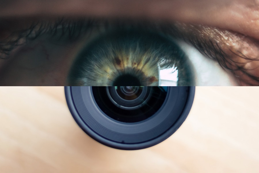 Split image of eye and camera lens