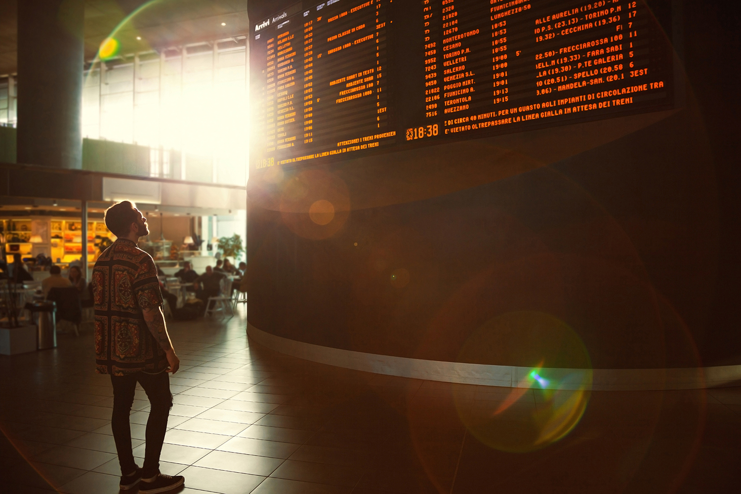Man viewing arrivals board