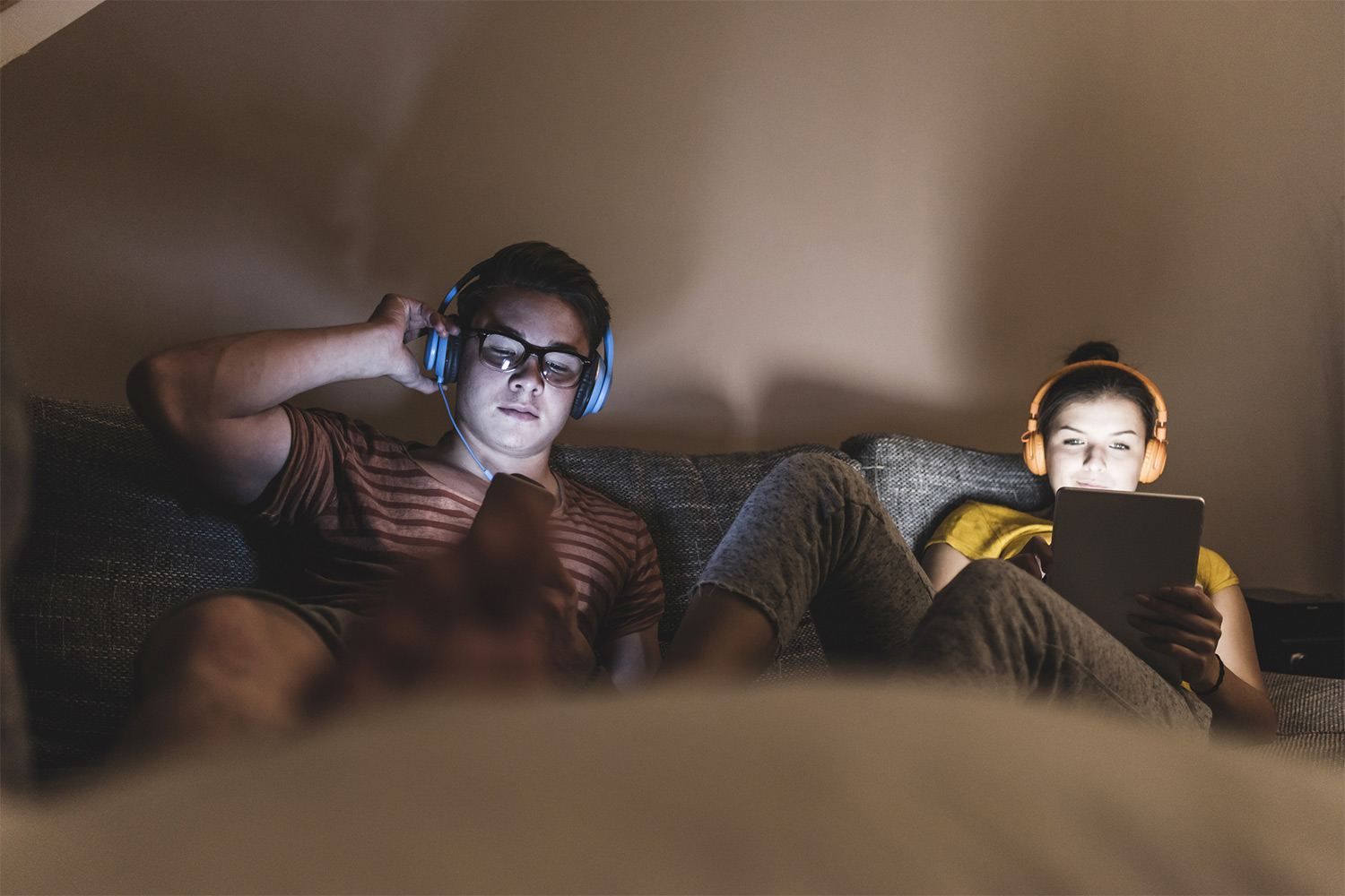 Couple using their mobile and tablet device