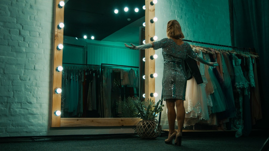 woman looking in mirror