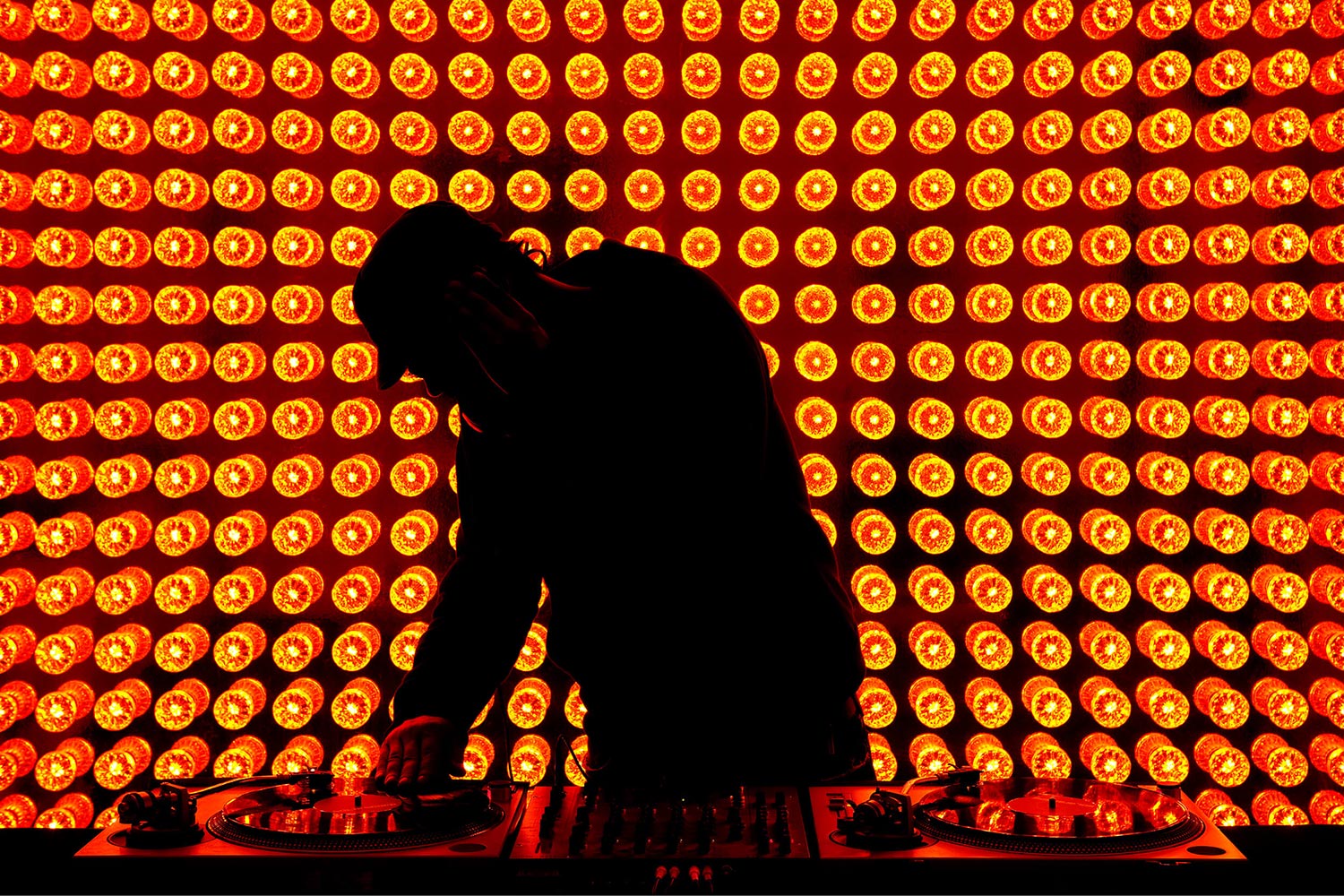 Man in front of light wall