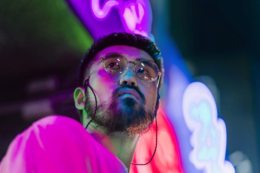 Man with neon light back-drop
