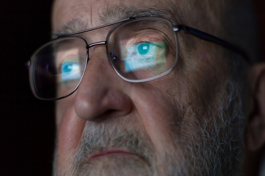 old man computer reflection in glasses