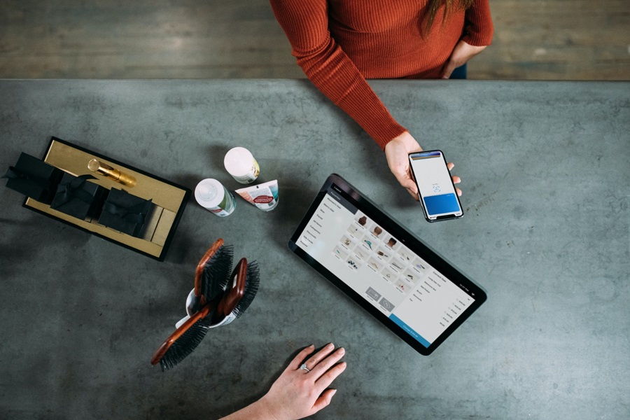 Person paying with smartphone