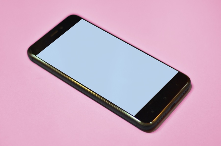 Smartphone on pink background