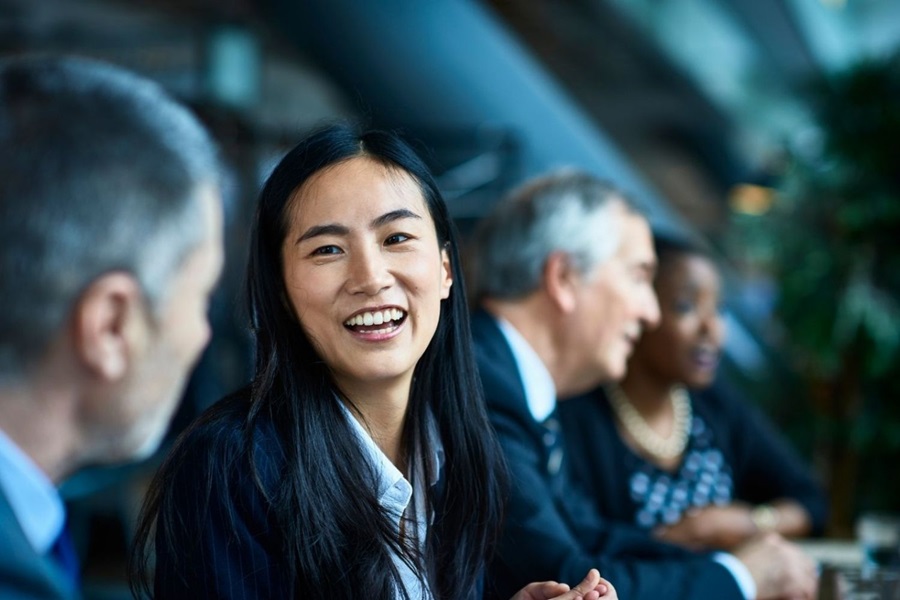 Young Businesswoman in G7 Smiling