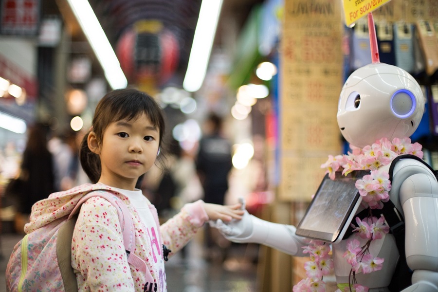 Young girl with robot