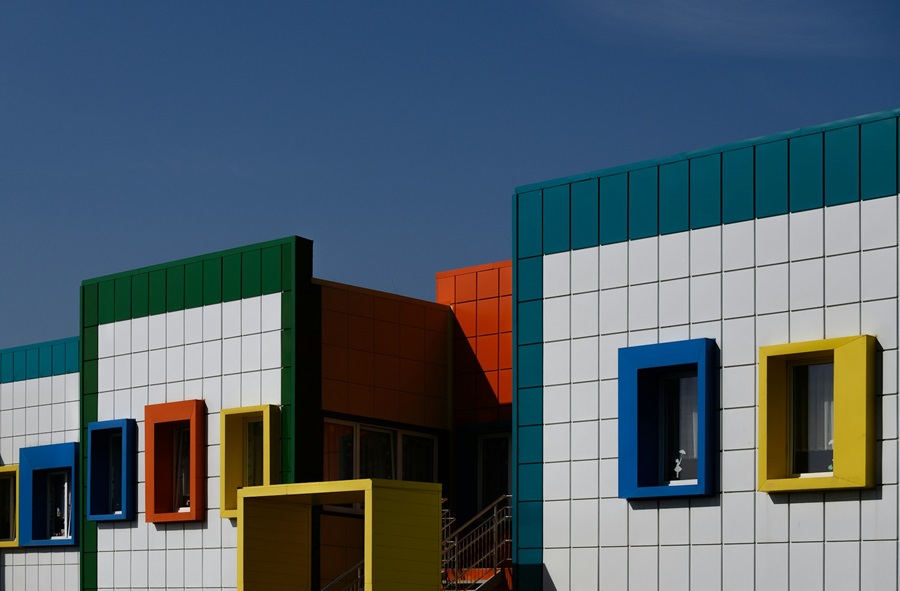 Colourful buildings against a blue skyline