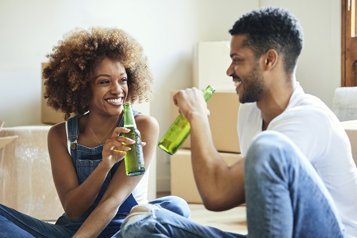 young couple drinking bottled beer
