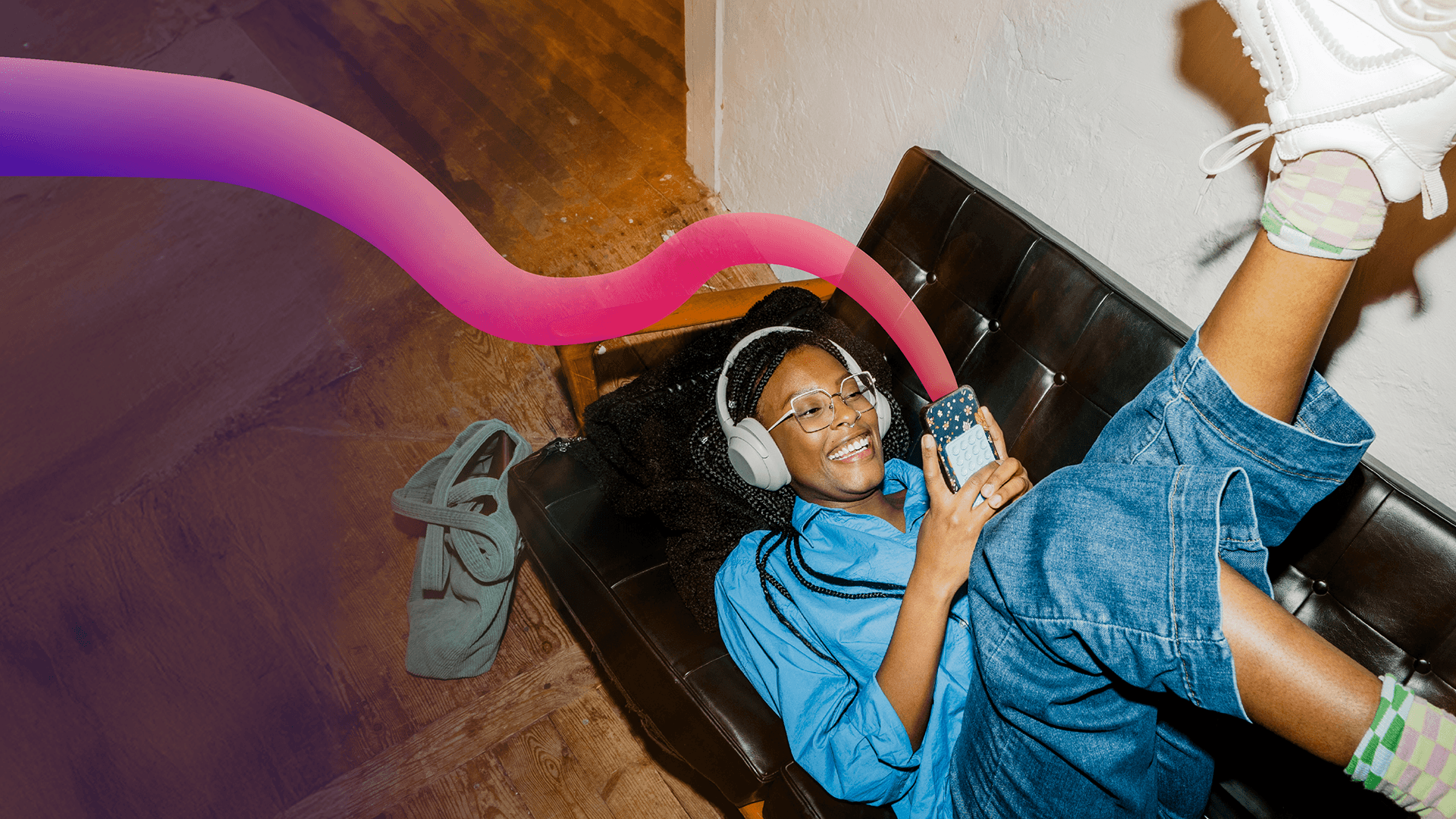 person on sofa on phone