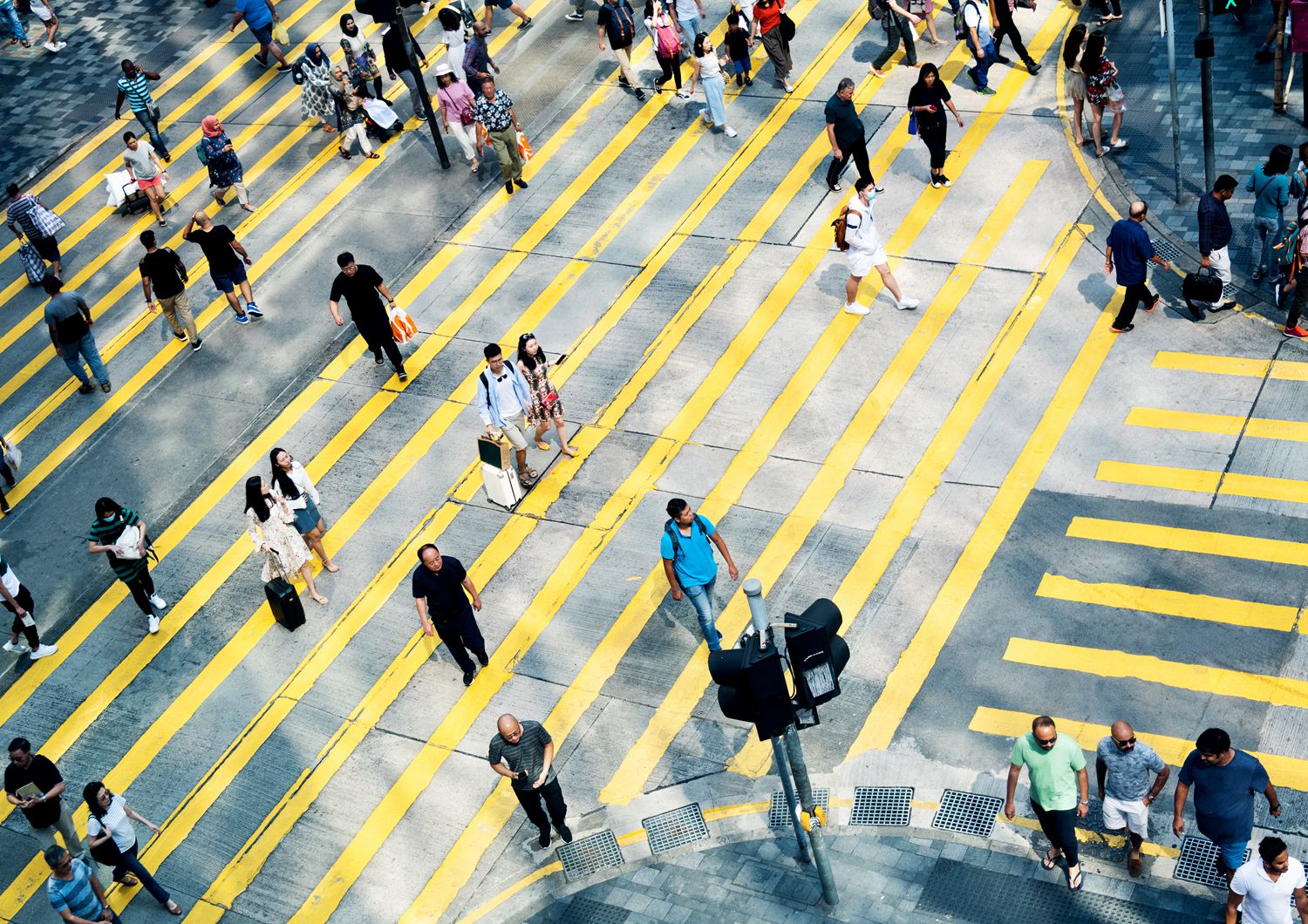 Aerial view of rush hour in city crosswalk