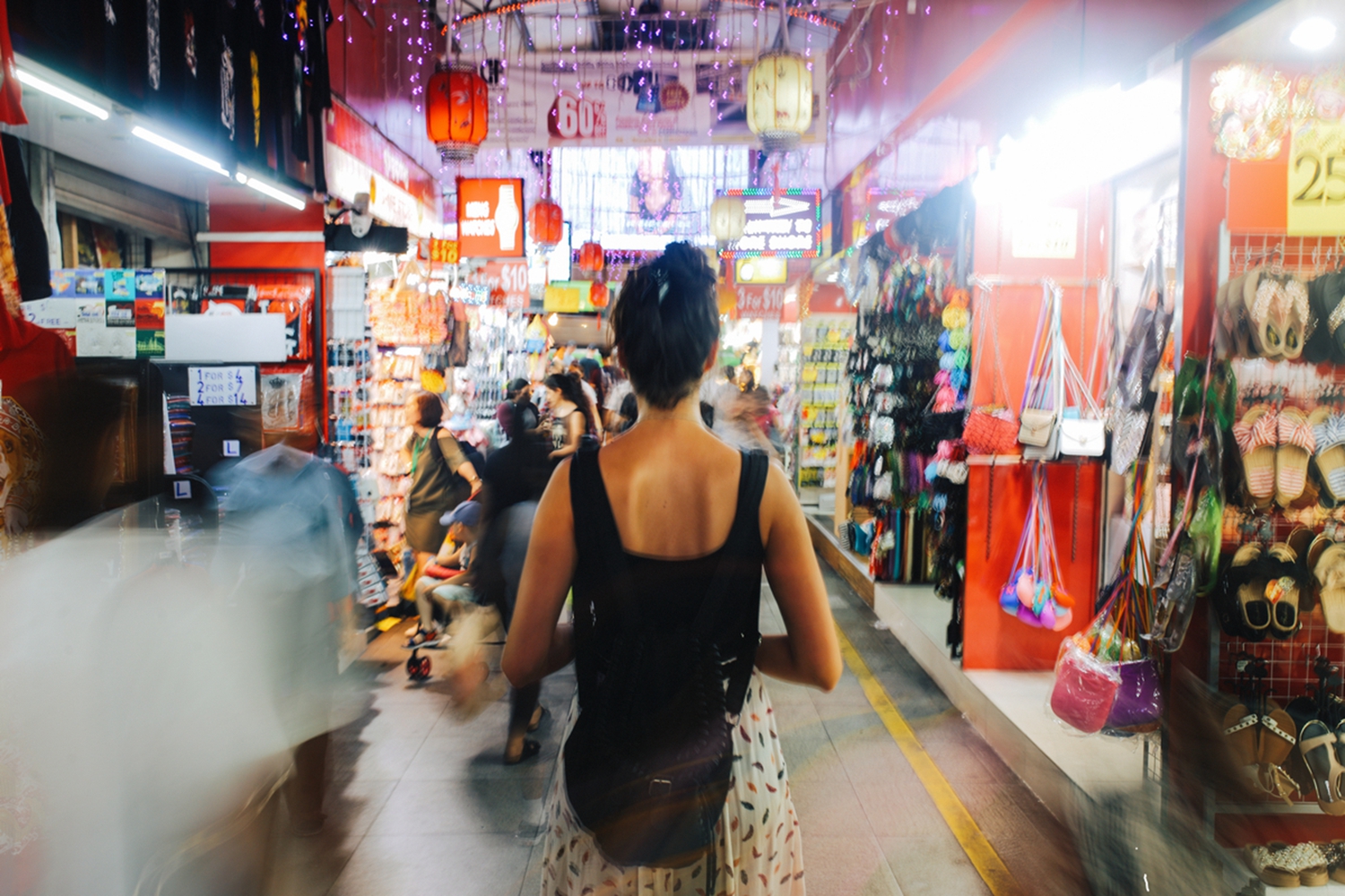 Woman traveller in the busy markets of Singapore