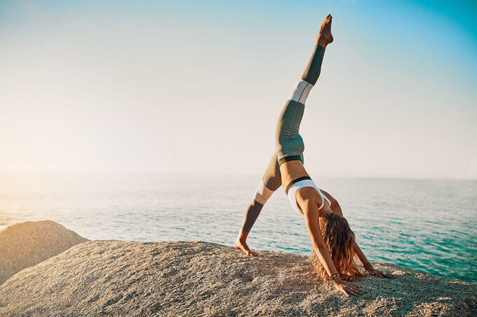 Woman exercising on a beach