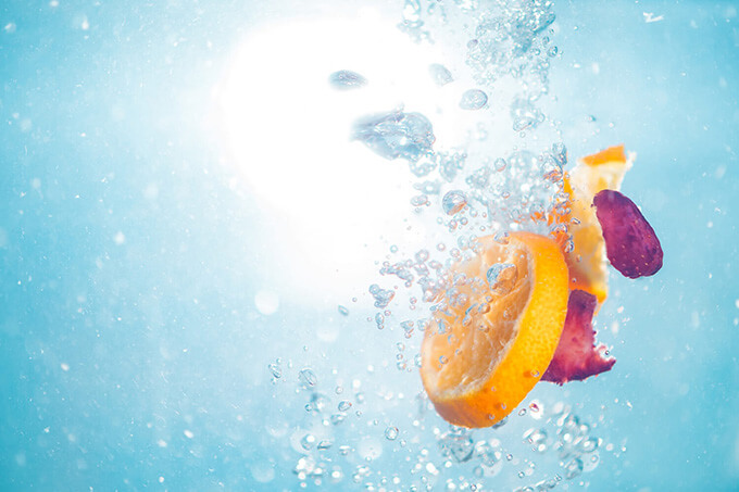 Fruit and bubbles in water