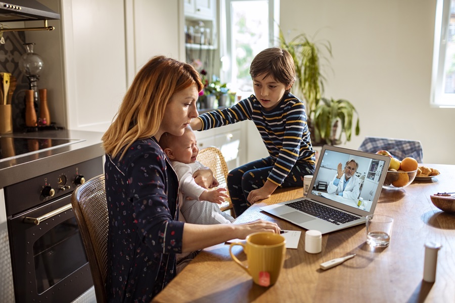 mom and children having a virtual telehealth visit