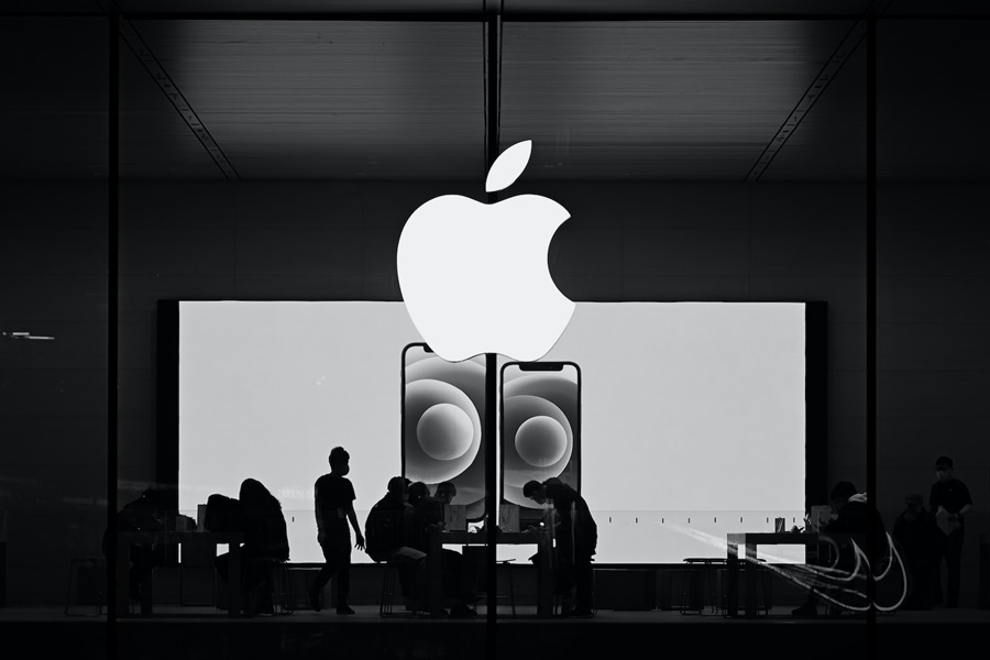 Apple store with people browsing Apple products