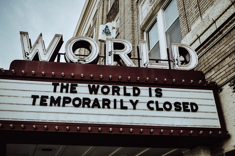 Theater marquee saying the world is closed