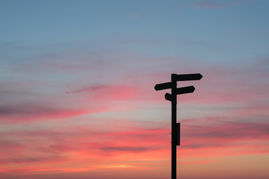 Signpost against a sunset backdrop