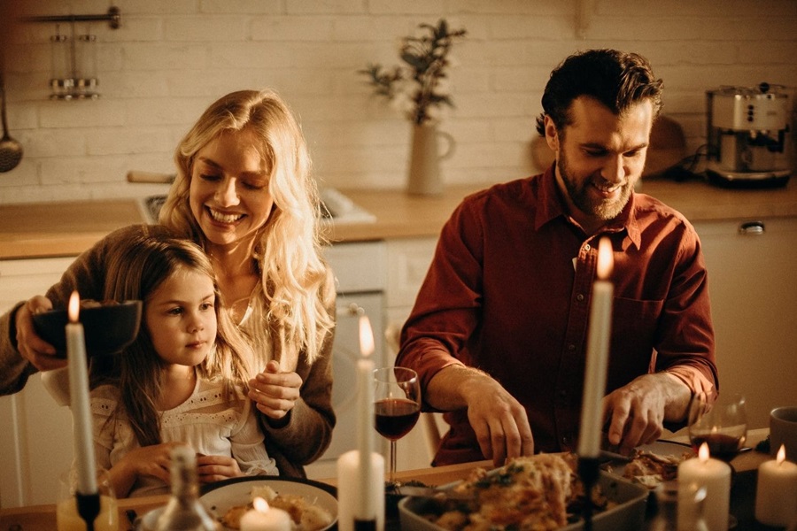 family at home eating dinner