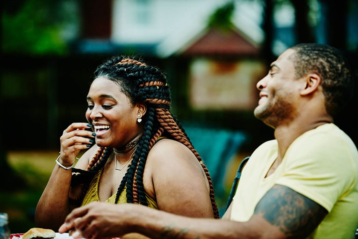 Two people laughing together