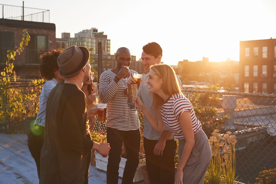 Young people toasting on a rooftop